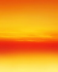 Obraz premium A vibrant sunset blending warm hues of orange and yellow in the sky.