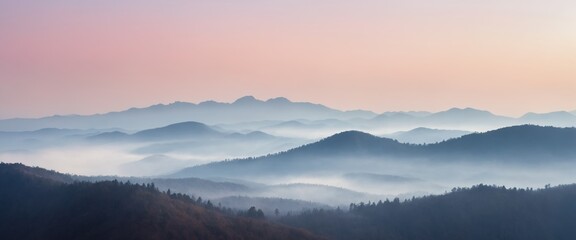 Fototapeta premium Layered Mountain Silhouettes in Morning Mist – Scenic Horizon