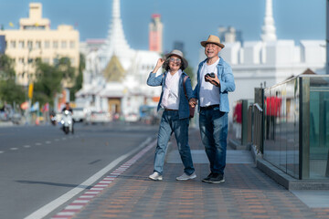 Senior couples' tourist activities around the Grand Palace and Wat Phra Kaew, Thailand