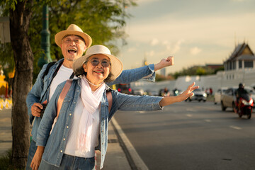 Senior couples' tourist activities around the Grand Palace, Thailand