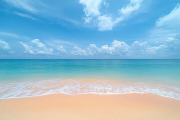 Fototapeta premium Serene beach scene with turquoise water and soft clouds overhead.