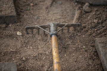 Fototapeta premium Garden tools in the ground. Shovel on the ground. Gardening concept. 