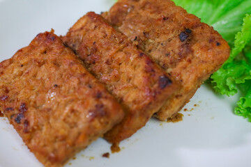 Tempe and tahu bacem are the traditional foods from Indonesia. Made from soya bean. Bacem means sweet.