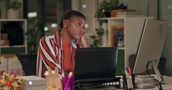 Business, black woman and bored by computer in office at night with deadline burnout and contemplating article. Journalist, employee and tired by desk for news story, research challenge or low energy