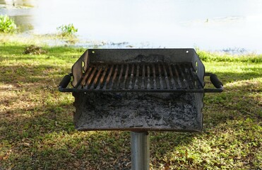 Empty charcoal grill, ready for a summer cookout.