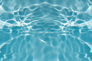 Obraz premium Blue water with ripples on the surface. Defocus blurred transparent blue colored clear calm water surface texture with splashes and bubbles. Water waves with shining pattern texture background.