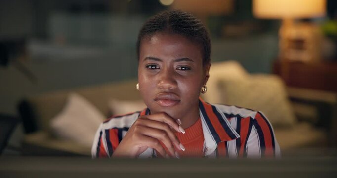 Computer, night and thinking with designer black woman in home office for remote work or web development. Business, creative and problem solving with design employee in apartment as freelancer