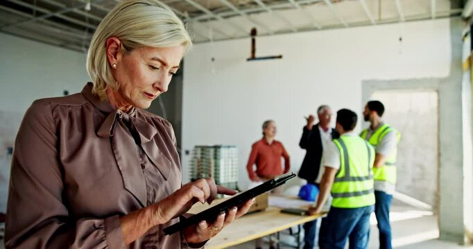 Architect, mature woman and tablet in building for online blueprint review, compliance check or project management. Interior design, digital checklist and site inspection for home renovation progress