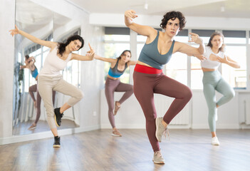 Group of women dancing energetic hip hop dance in studio