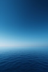 Obraz premium arafed view of a calm ocean with a blue sky