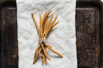 Top view of fried corn stick snack on a linen napkin, Overhead view of nigerian kokoro corn snack