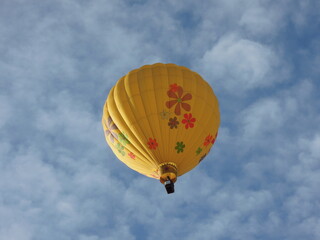 Yellow hot air balloon flying in the sky, Erie, Colorado