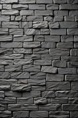 a close up of a black stone wall with a black fire hydrant