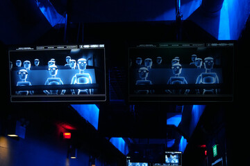 Two Computer Screens Showing People In A Virtual Cinema Sitting On Moving Rotating Chairs 