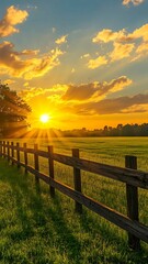 Obraz premium A breathtaking display of nature's artistry, where the sun's rays pierce the clouds, illuminating the field.