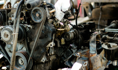 The mechanic is inspecting the internal condition of the engine.