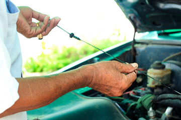 The mechanic is inspecting the internal condition of the engine.