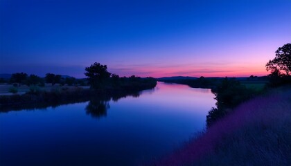 Serene river at twilight with vibrant colors.