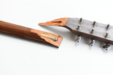 part of broken wood acoustic guitar isolated on white background