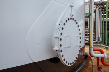 Manhole of the white fuel tank.