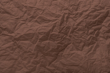Mocha Mousse paper wrinkled texture for background and copy-space. Color of the Year 2025
