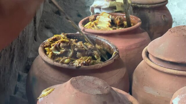 Earthen pot with mutton prepared in Bihari style