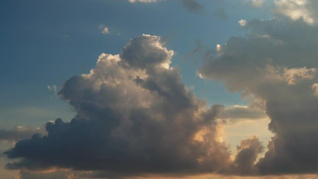 Time lapse of clouds colored by the sunset