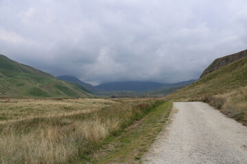 Fototapeta premium Road into a Cloudy Valley