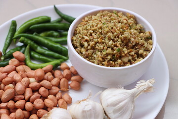 Hirvi Mirchi cha thecha, Dry green chutney made from garlic chilli peanuts which is famous in maharashtra