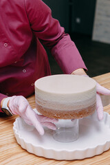 Cooking mousse cake at a cooking class. Cooking at home, home-made food. Demonstrating the colors of 2025 year - Mocha Mousse