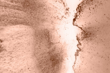 Epoxy resin paint, abstract background. Demonstrating the colors of 2025 - Mocha Mousse