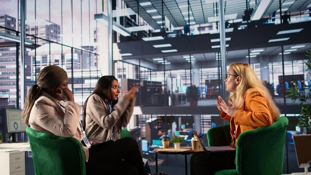 Frustrated businesswomen starting an argument and expressing their irritation, dealing with an enterprise failure and negative outcome. Stressed angry associates fighting in a meeting. Camera B.