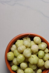 Rai aamla, Indian Gooseberry or phyllanthus acidus fruits 