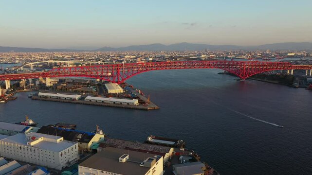 Aerial view over Osaka bay Kansai Japan with Minato bridge or red bridge with Osaka city in the background.	