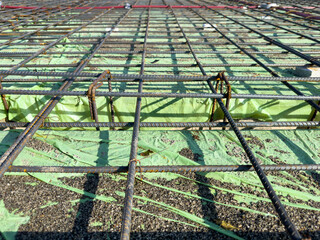 Close-up of a steel mesh structure use as a reinforcement of concrete in a construction project.