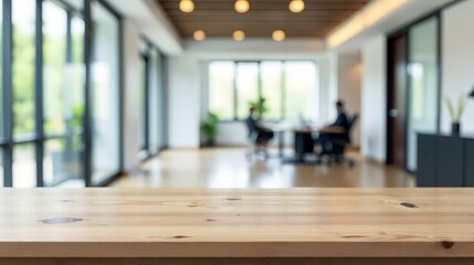 Contemporary office workspace with wooden table and blurred colleagues working