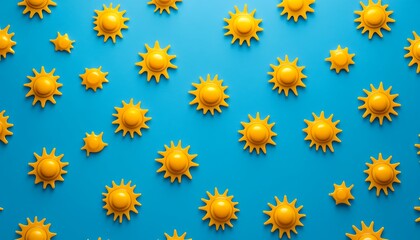 Obraz premium A vibrant blue background adorned with yellow sun motifs, creating a cheerful, playful atmosphere.