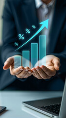 A businessman holds up glowing bar graphs, showcasing growth and success, with a laptop and smartphone on the table. Ideal for presentations, financial reports, and marketing materials