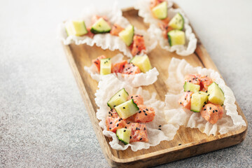 Cucumber and Salmon with Crispy Rice Chips. Trend snack