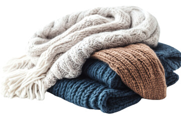 Cozy Knit Blanket Stack: A stack of three knitted blankets in beige, brown, and blue, with tassels on the beige one. The warm textures and colors create a comforting and cozy atmosphere.  