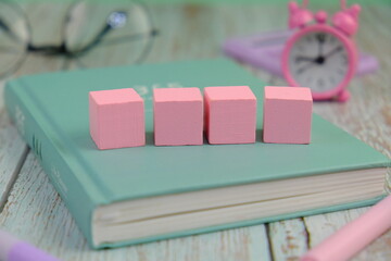 Wooden block, alarm clock with no word as a template for text space concept. business concept