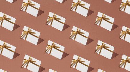 Isometric pattern of credit cards, gift cards, bonus cards. consumer concept, on a brown mocha...