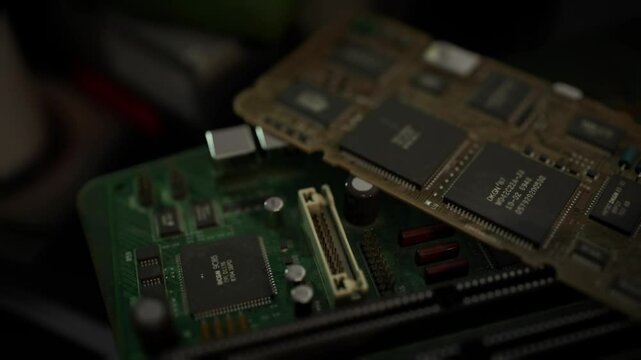 This close up view captures detailed circuit boards featuring various electronic components, highlighting their complexity and design. The image reveals the inner workings of electronics.