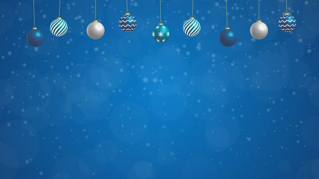 Blue christmas background with baubles and falling snow. Christmas and new year templete with copy space.