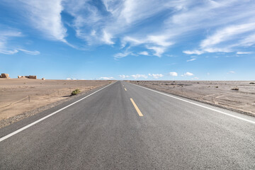 Asphalt highway road and desert natural landscape under the blue sky. Outdoor road background.