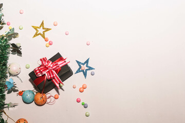 Season's greetings scene. Christmas decorations,gift boxes with red ribbons, сhristmas balls, ...