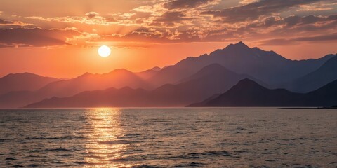 Fototapeta premium Serene Sunset Over Coastal Mountain Range, Golden Hour Hues Reflecting on Calm Waters