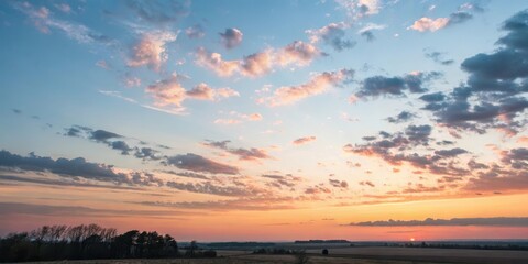 Serene Sunset Landscape Pastel Hues Paint the Sky with a Burst of Warm Colors over a Tranquil Field