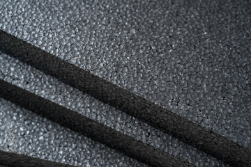 Top view of grey thermal insulation styrofoam sheets stacked on top of each other