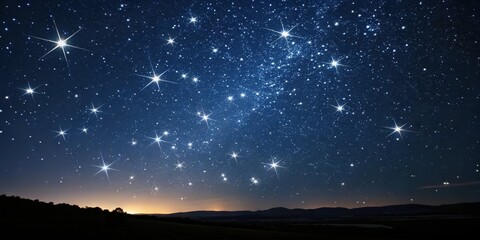 Fototapeta premium A breathtaking night sky panorama reveals a vast expanse of twinkling stars, brilliantly shining above a dark, rolling hills landscape at twilight.